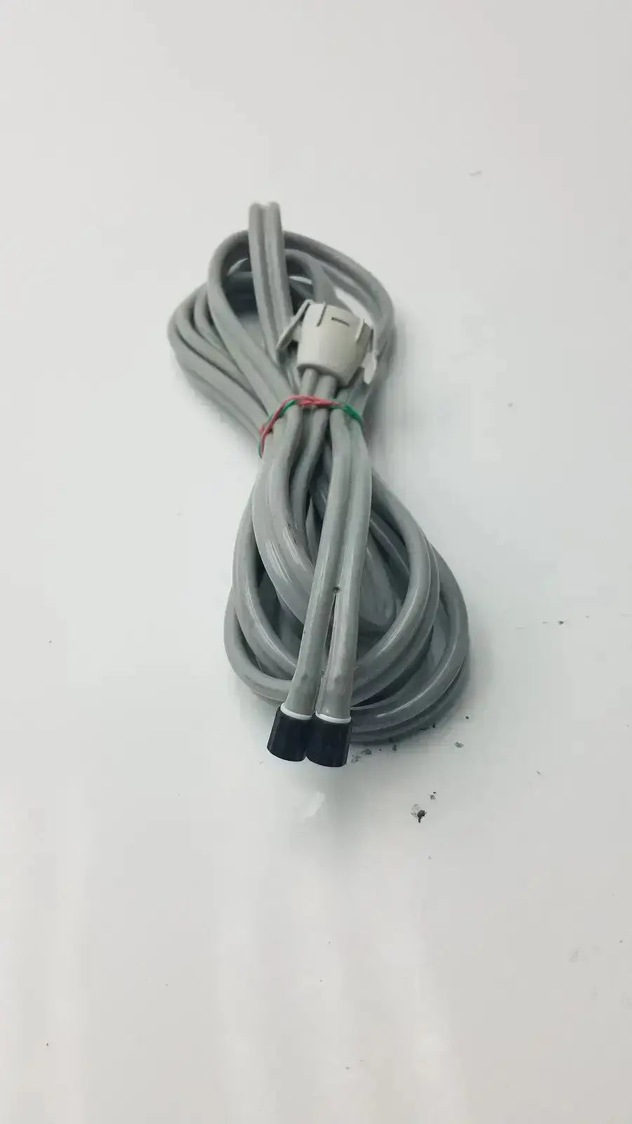 Gray welch allyn blood pressure hose with locking connector white end and black tips double-tube design