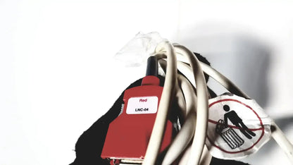 Red lnc-04 connector with black tip wrapped in white cables on the back of welch allyn connex vital signs monitor 6000 series