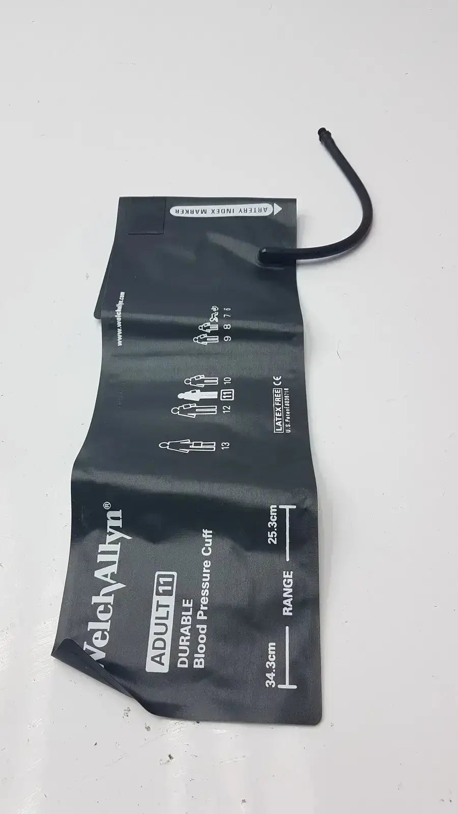 Black velcro welch allyn durable adult blood pressure cuff with measurement markings and short black tube