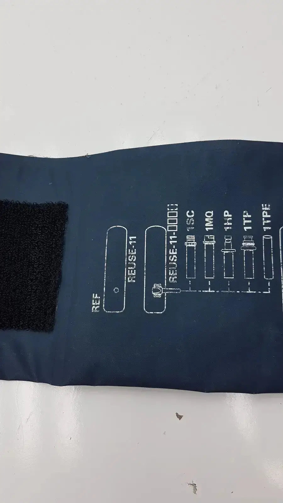 Dark blue welch allyn flexiport reusable blood pressure cuff g-bbdc4-11j with black velcro and white sizing chart