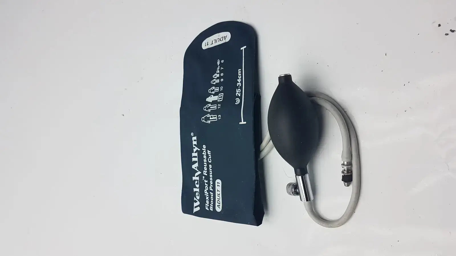 Black Welch Allyn FlexiPort reusable blood pressure cuff with inflatable bulb and tubing for adult 25 to 34 cm arm