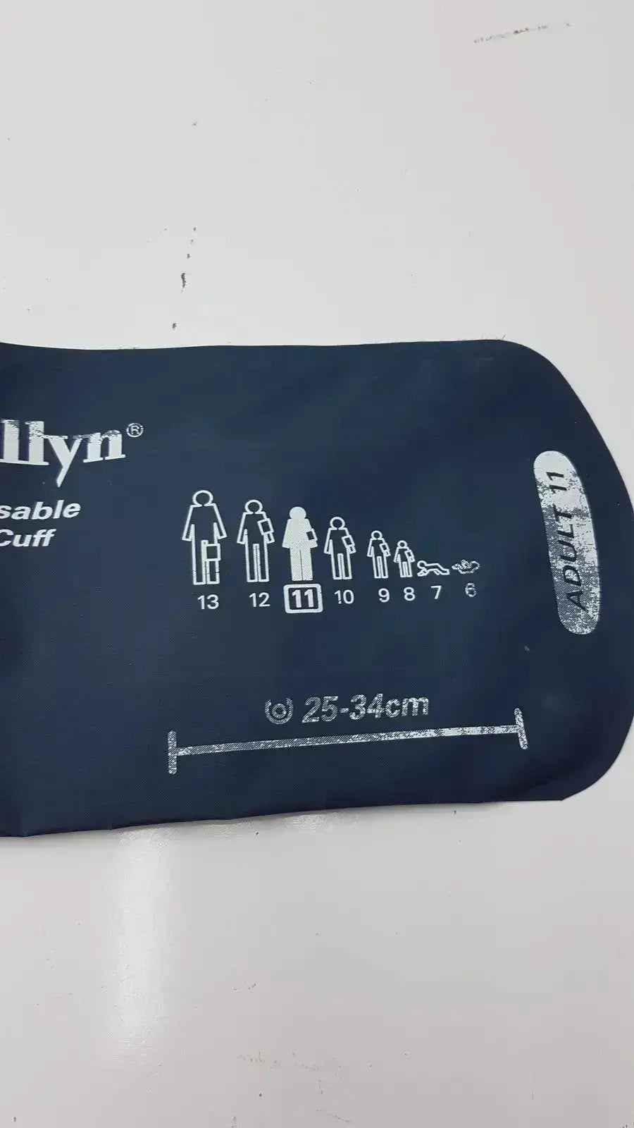 Dark blue inflatable welch allyn flexiport reusable blood pressure cuff with white sizing chart adult 11 g-bbdc4-11j