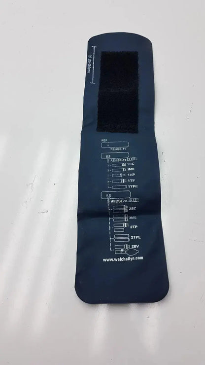 Dark blue fabric fuse tester with printed labels and black cutout on welch allyn flexiport g-bbdc4-11j cuff back side