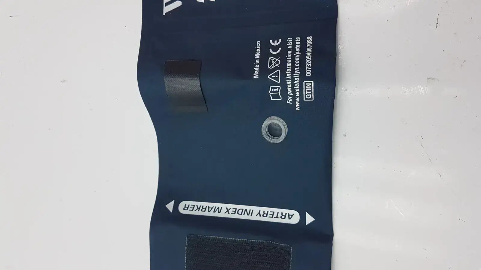 Dark blue welch allyn flexiport reusable blood pressure cuff adult long 11l with artery index marker and black velcro tabs