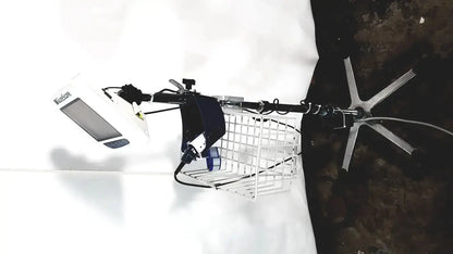 White metal wire basket with a black and white welch allyn glidescope cobalt avl monitor mounted on its frame
