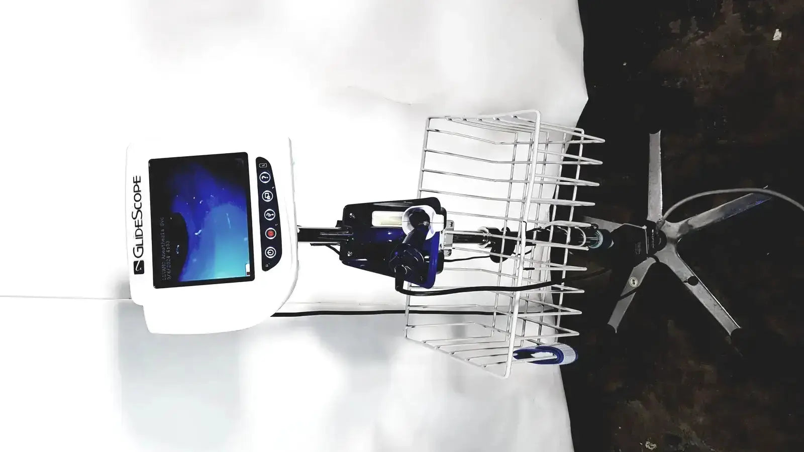 Welch allyn glidescope cobalt avl video laryngoscope with blue screen and black buttons on adjustable stand and cart