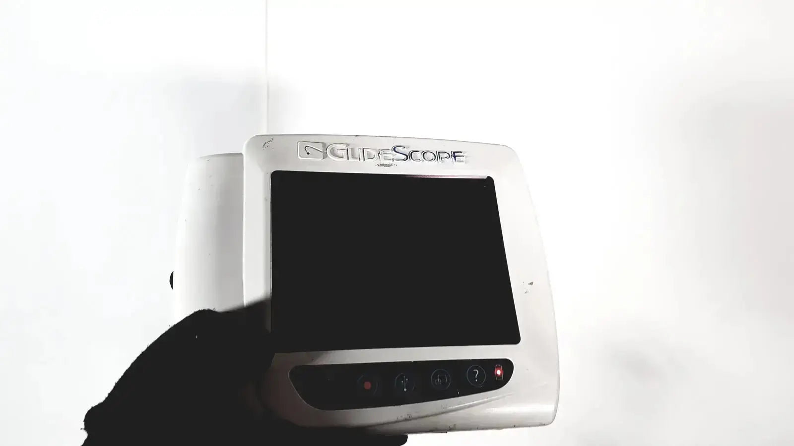 Welch allyn glidescope cobalt avl monitor with white body, black screen, and control buttons on cart and stand