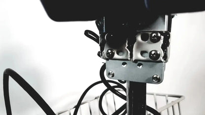 Black camera mount with metallic bracket and screws attached to pole on back of welch allyn glidescope cobalt avl monitor stand