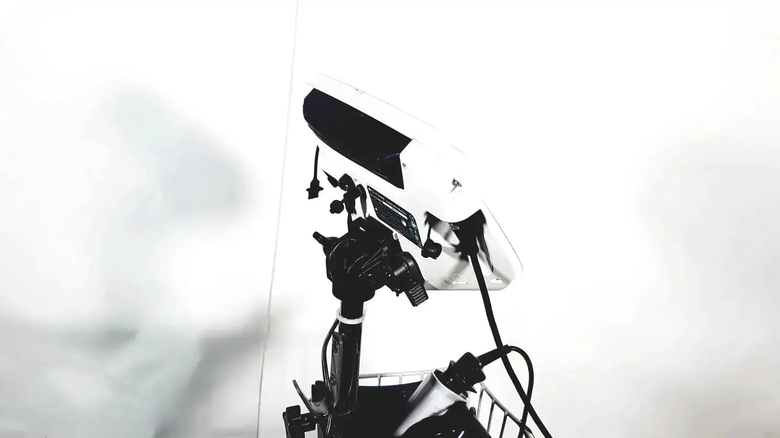 White and black studio lighting panel mounted on stand with welch allyn glidescope cobalt avl monitor and cart