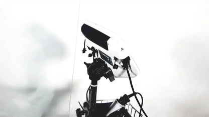 White and black studio lighting panel mounted on stand with welch allyn glidescope cobalt avl monitor and cart