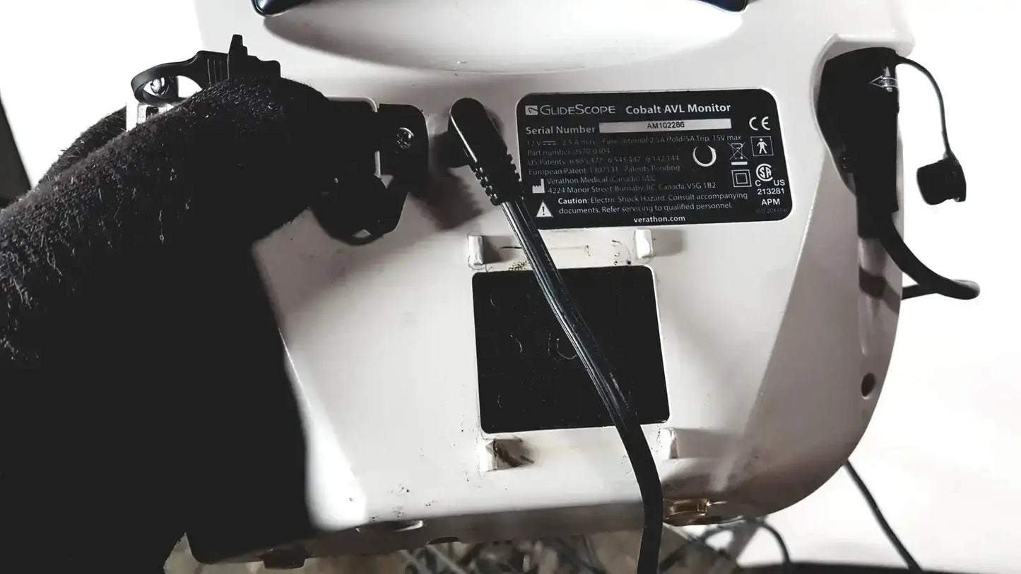 White welch allyn glidescope cobalt avl monitor with black power cord and specification label shown from the back side