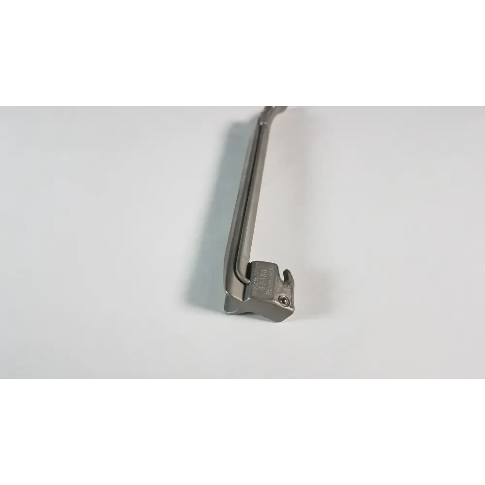 Silver surgical laryngoscope with a curved handle and a rigid, metallic blade.