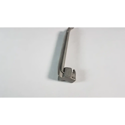 Silver surgical laryngoscope with a curved handle and a rigid, metallic blade.