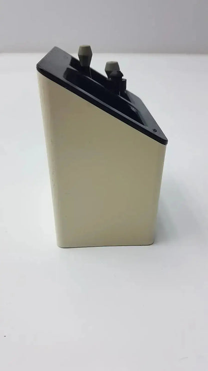 Beige rectangular battery with black top and gray terminal caps for welch allyn Model 71123 charging stand used medical equipment for sale