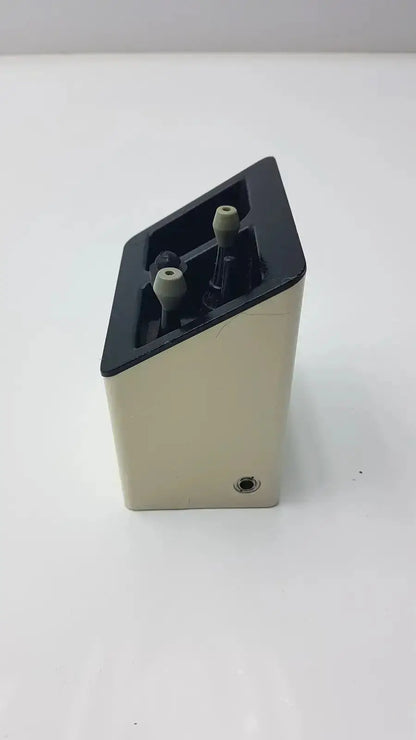 Beige and black rectangular welch allyn audio scope charging stand with two gray knobs used medical equipment for sale