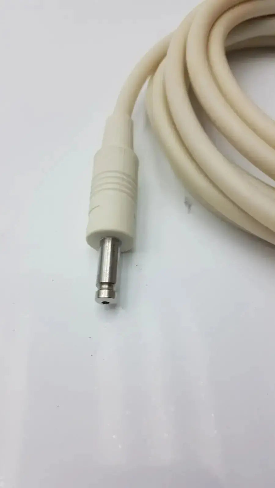 Beige patient monitor cable with metallic 6.35mm jack and ribbed plastic housing for Welch Allyn NBP monitor cable