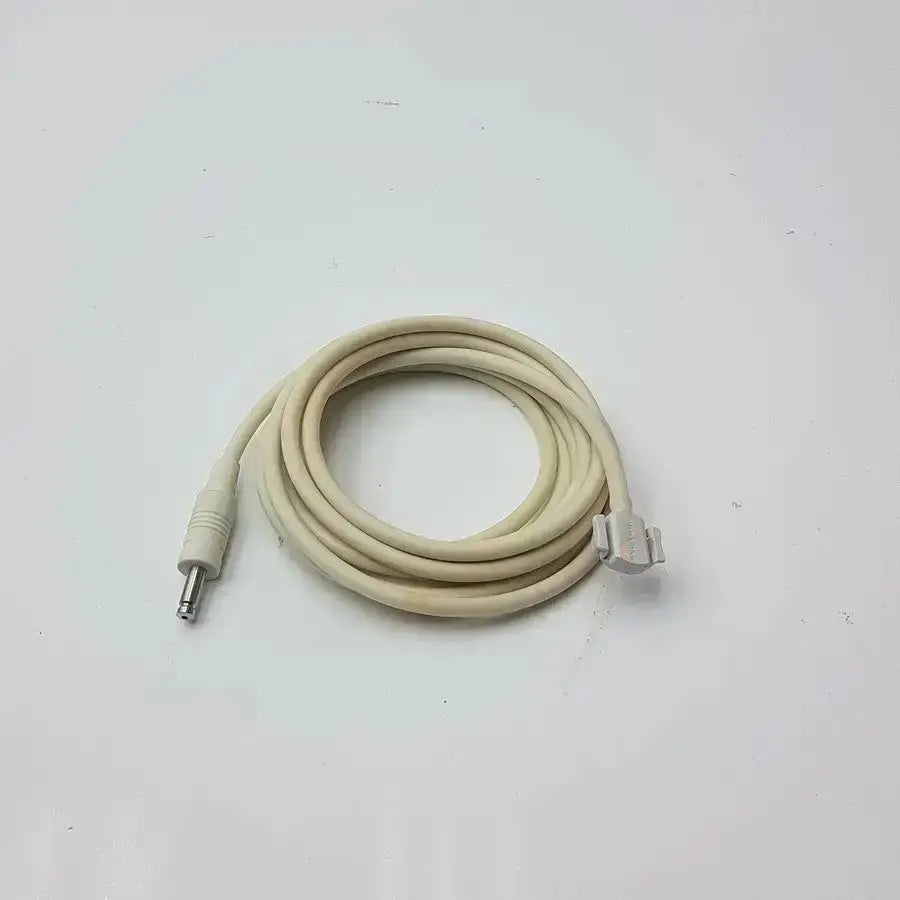 Beige coiled patient monitor cable with metallic 3.5mm jack and silver din connector for Welch Allyn NBP patient monitor