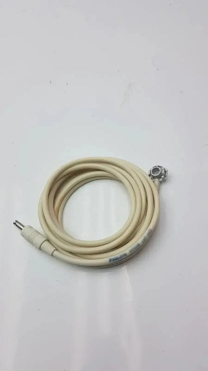 Beige coiled welch allyn patient monitor cable with metallic connectors for reliable patient monitoring use