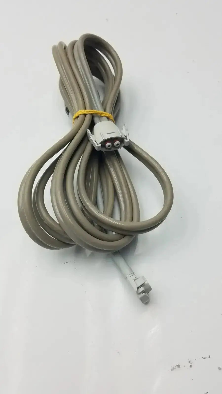 Gray coiled welch allyn double hose with white connector and yellow tie used medical equipment for sale