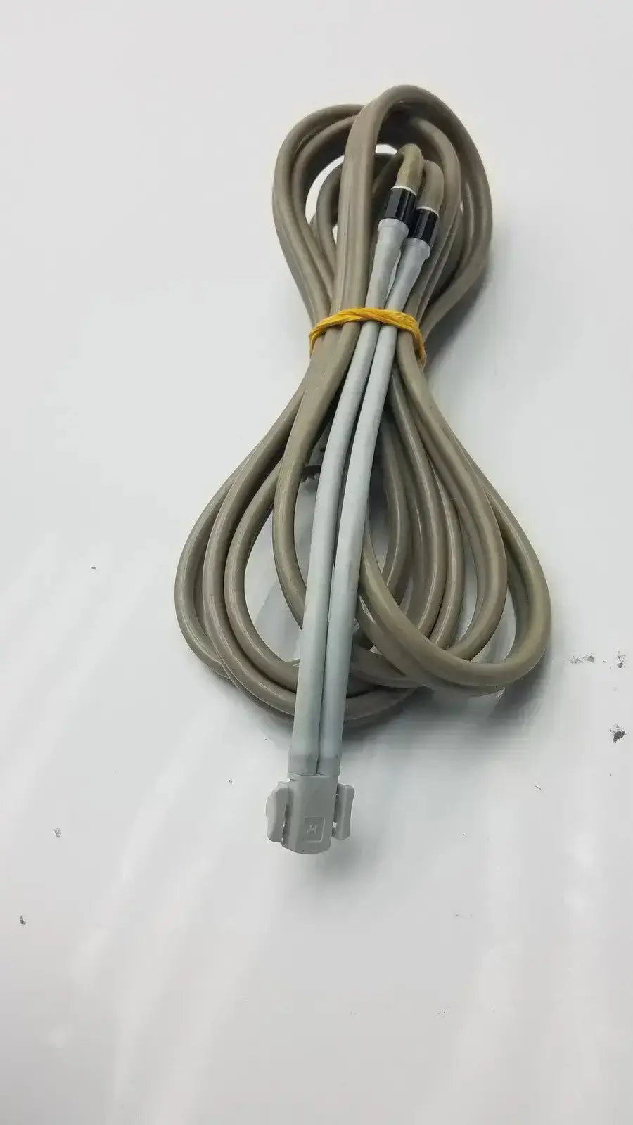 Coiled gray welch allyn double hose with black connectors and yellow tie used medical equipment for sale