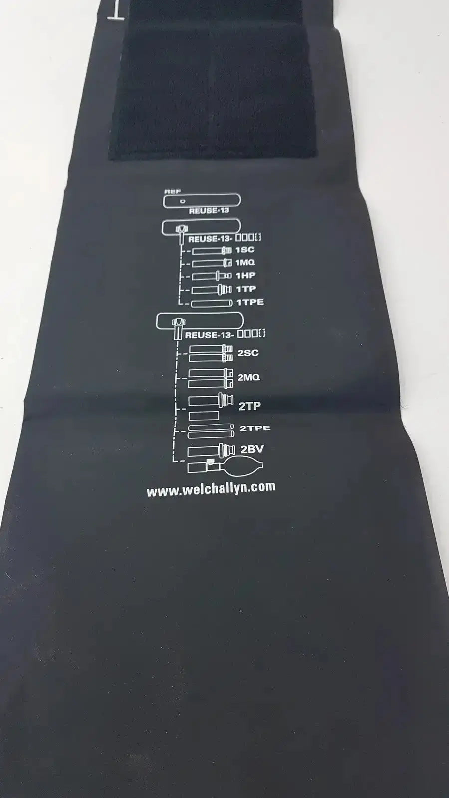 Black fabric welch allyn flexiport reusable blood pressure cuff tubing with white printed labels and website address