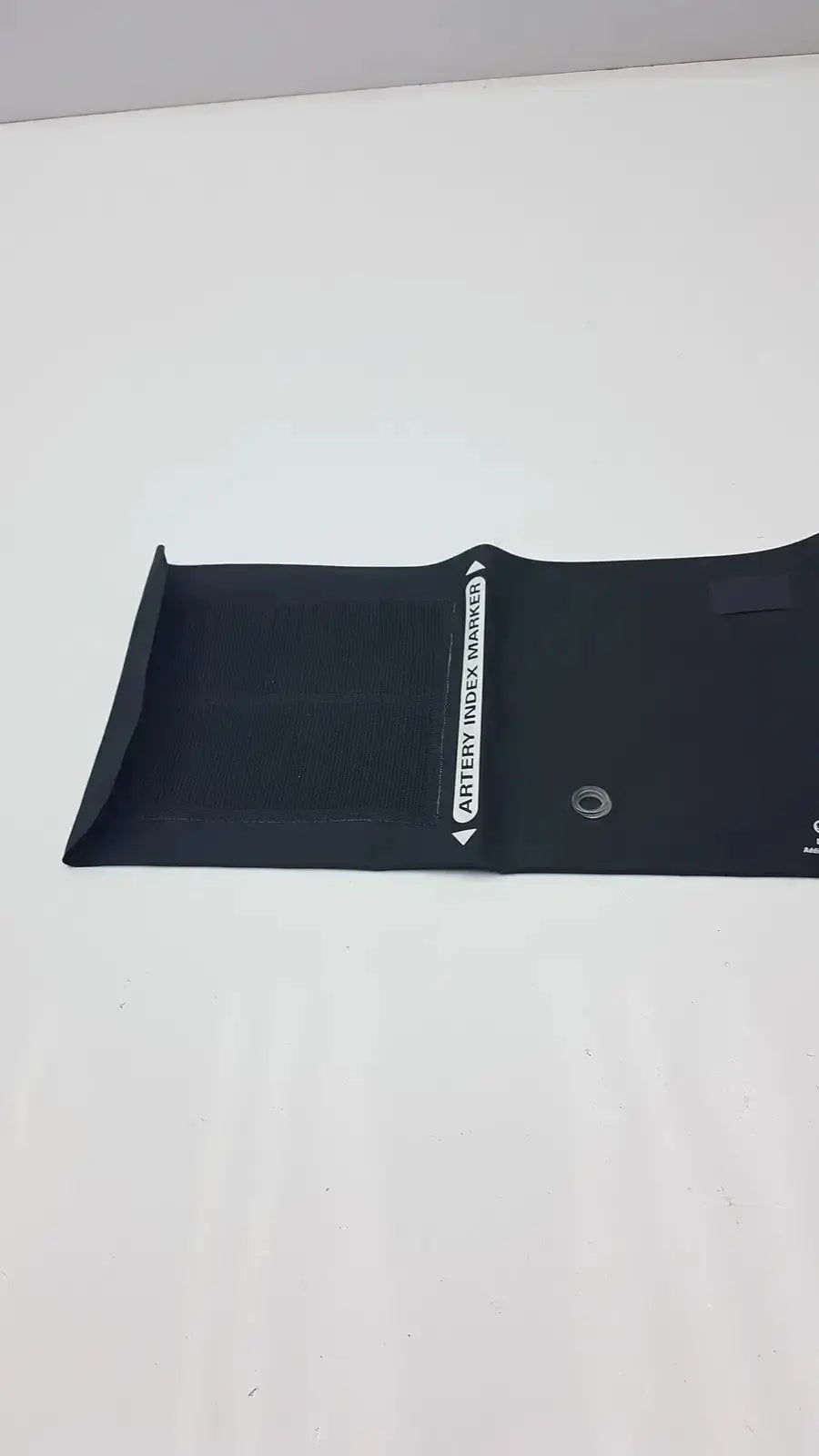 Black arterial index welch allyn flexiport blood pressure cuff made of smooth flexible material with white printed text