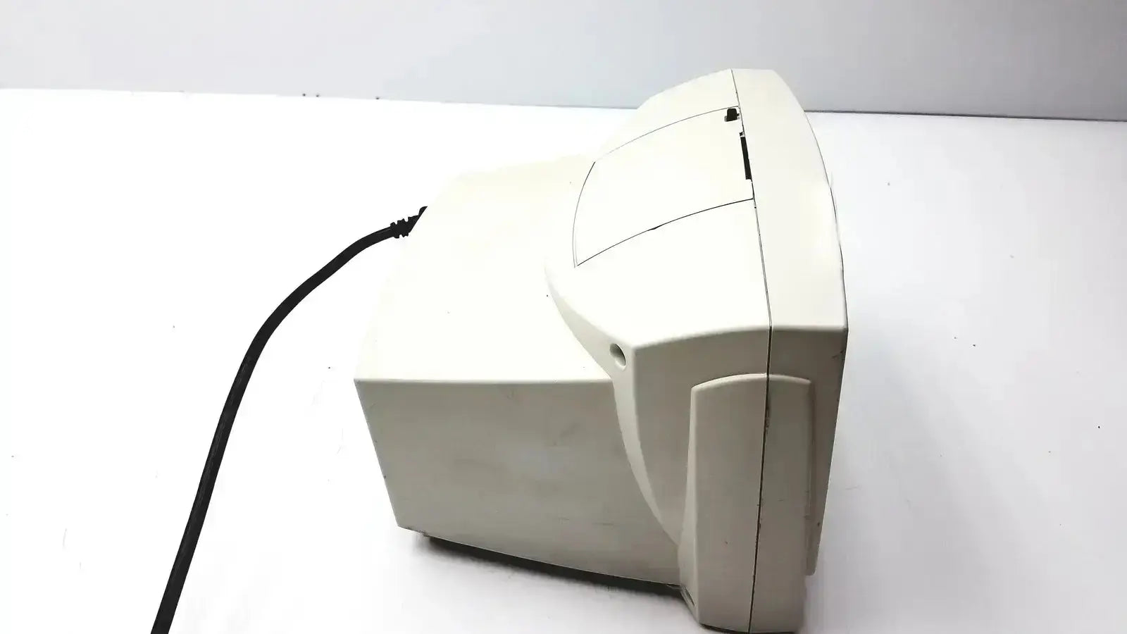 Beige plastic welch allyn vital signs patient monitor with curved crt screen and visible power cord