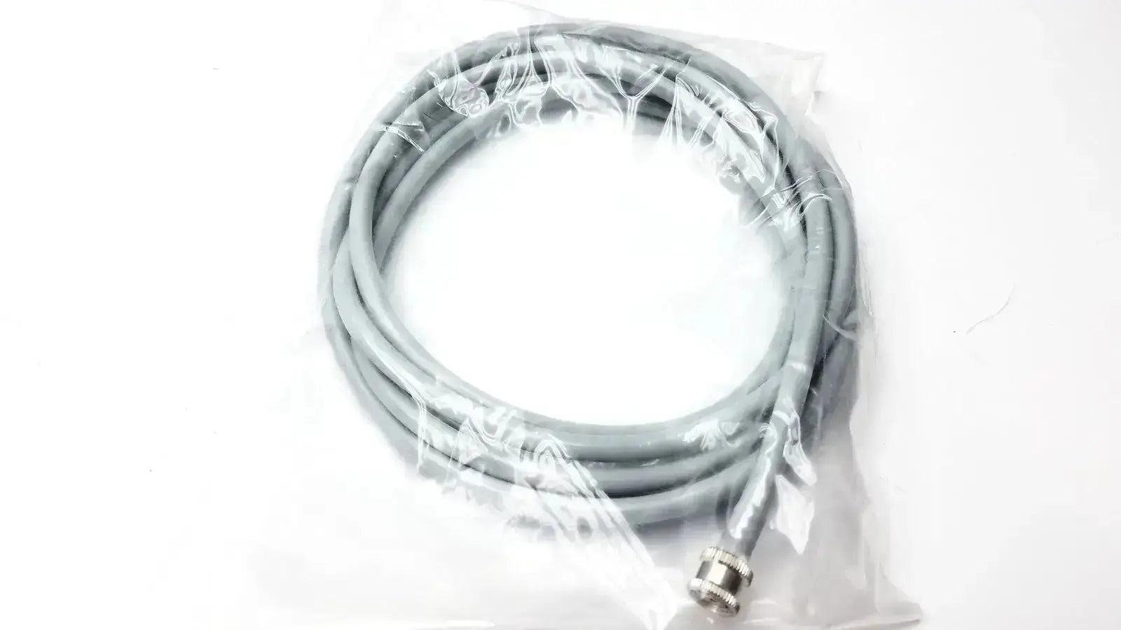 Gray coiled cable with metallic connector in clear plastic packaging for welch allyn vital signs patient monitor accessories