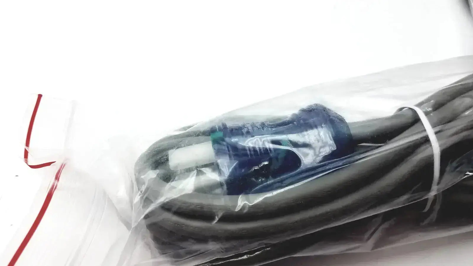 Black power cord with blue and white plug for welch allyn vital signs patient monitor packaged in clear plastic
