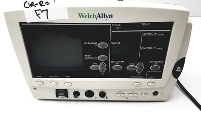 White welch allyn vital signs patient monitor with black display screen showing medical readings and control buttons