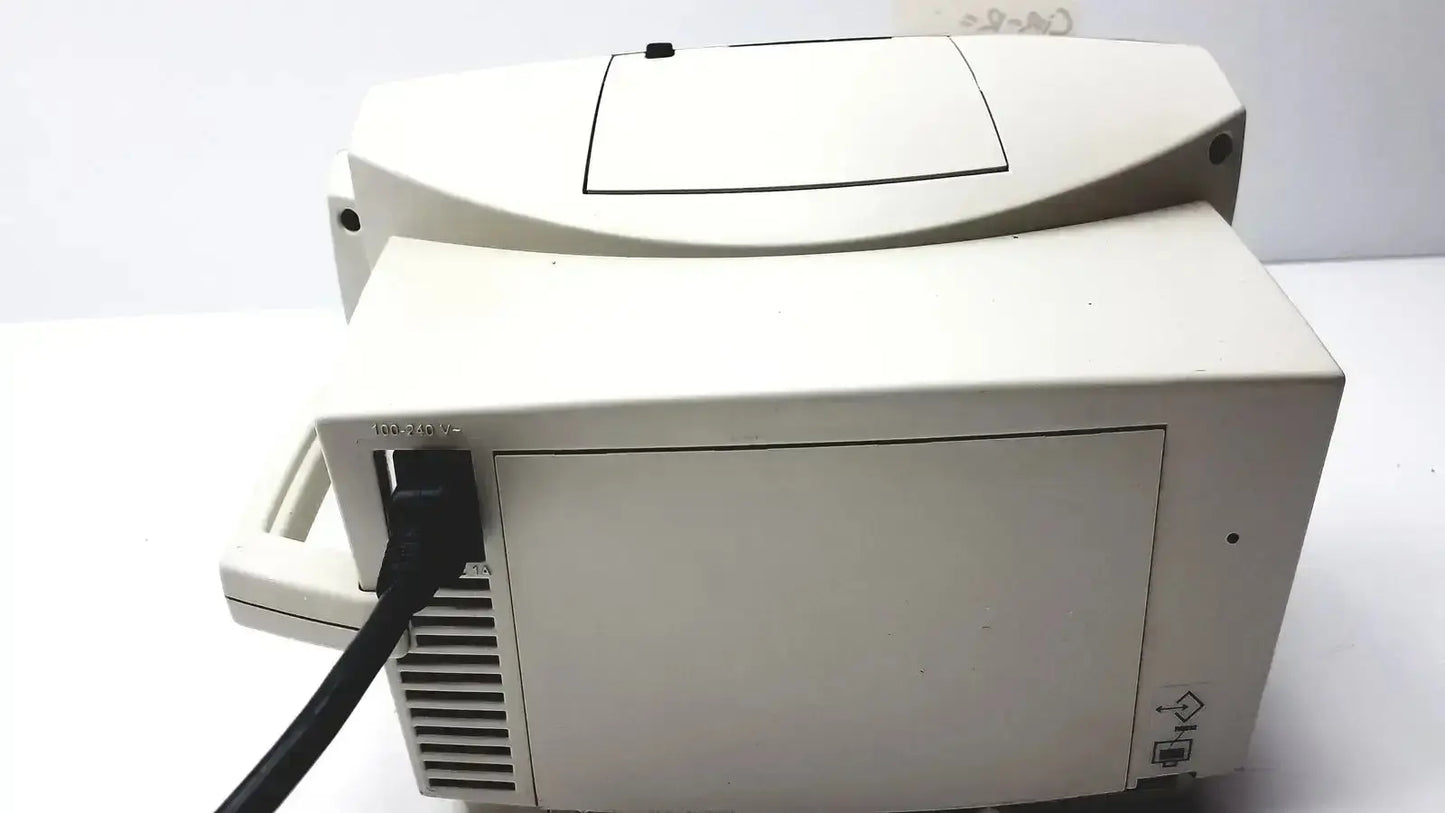 Beige plastic desktop printer with black power cord plugged in for welch allyn vital signs patient monitor accessories
