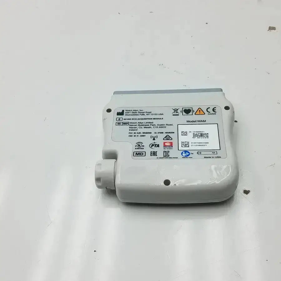 White plastic welch allyn wireless ecg acquisition module with gray top edge and labeled specifications visible from front view