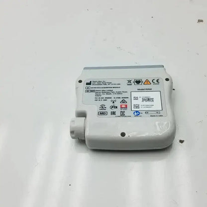 White plastic welch allyn wireless ecg acquisition module with gray top edge and labeled specifications visible from front view