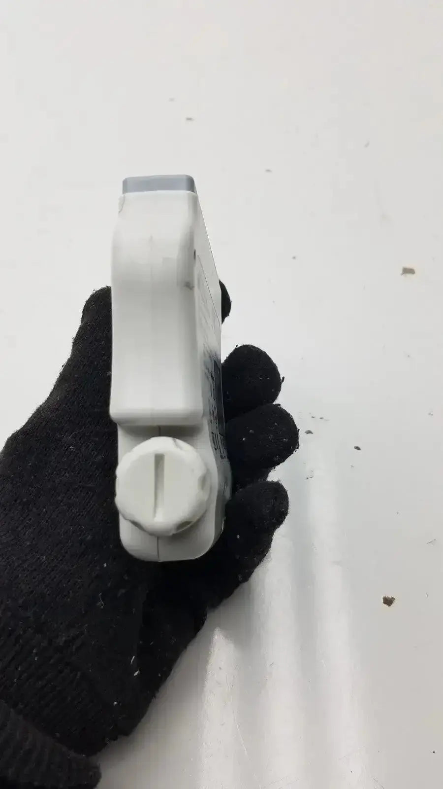 White plastic spray bottle with gray cap and textured nozzle for welch allyn wireless ecg acquisition module use
