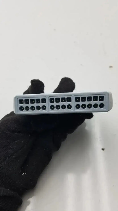 Gray plastic wireless ecg acquisition module by welch allyn with three rows of black network ports
