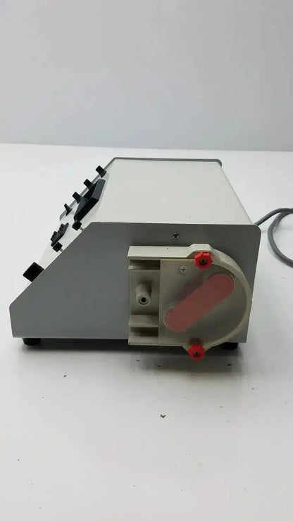 Gray plastic wheaton unispense ii dose laboratory pump with red accents and black knobs cat no 374300 g-bbdd4-14u