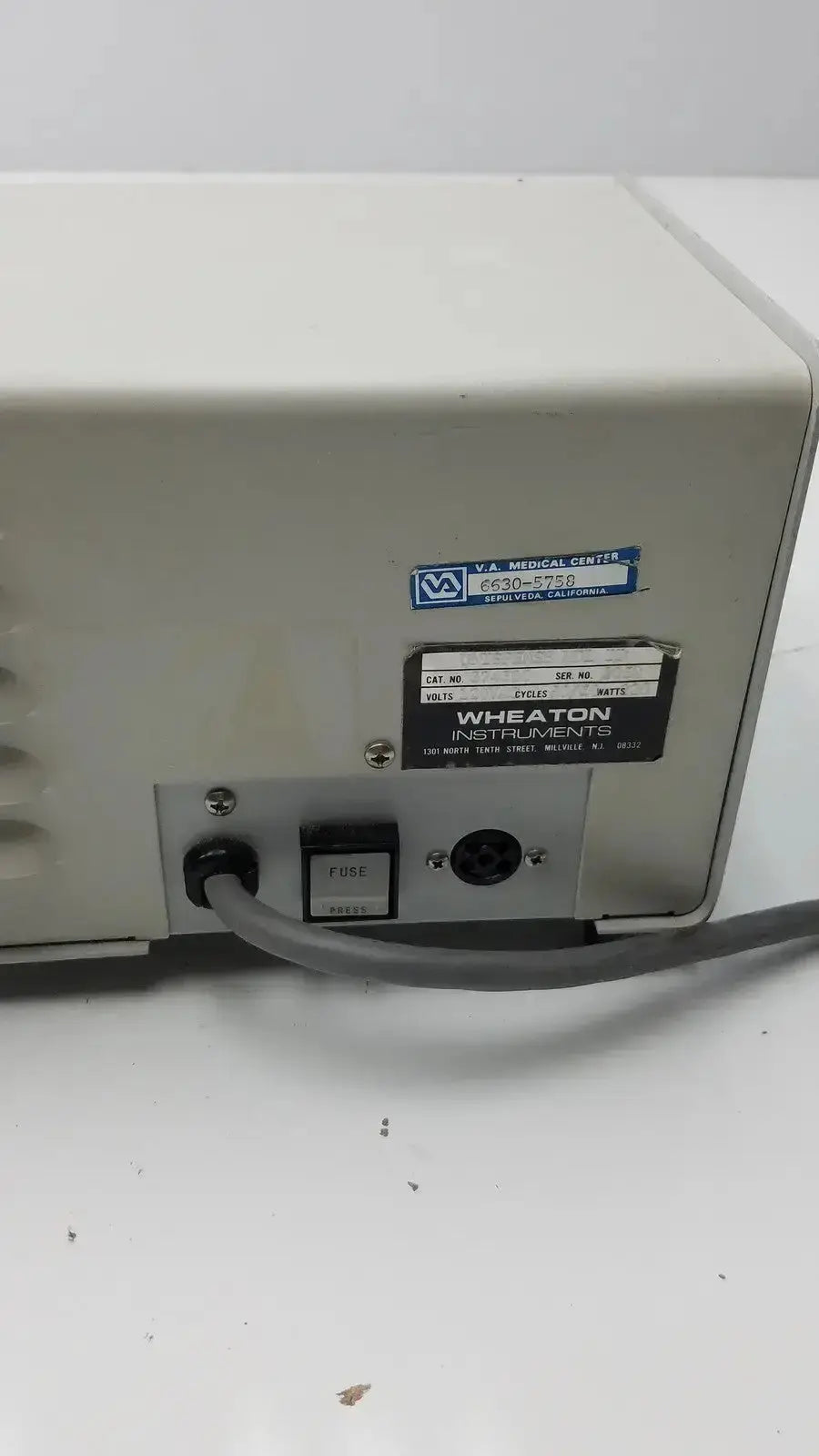 Beige Wheaton unispense II dose counter medical device with black label and power switch model g-bbdd4-14u