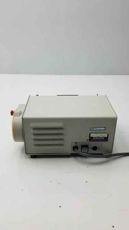 Beige rectangular wheaton unispense ii dose counter with red knob ventilation slits and miratone label g-bbdd4-14u cat no 374300