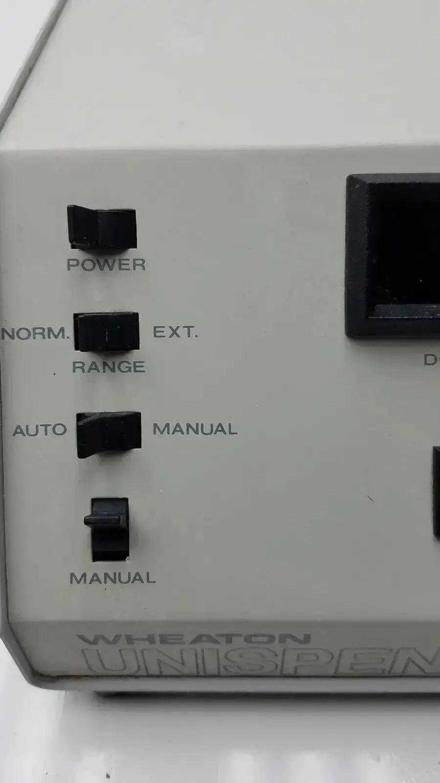 Gray wheaton unispense ii dose counter g-bbdd4-14u with black toggle switches labeled power and norm./ext