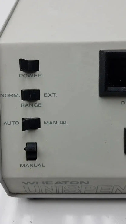 Gray wheaton unispense ii dose counter g-bbdd4-14u with black toggle switches labeled power and norm./ext