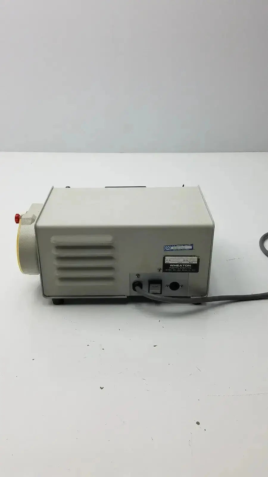 Beige rectangular laboratory pump with red knob and black power cord wheaton unispense ii dose counter g-bbdd4-14u