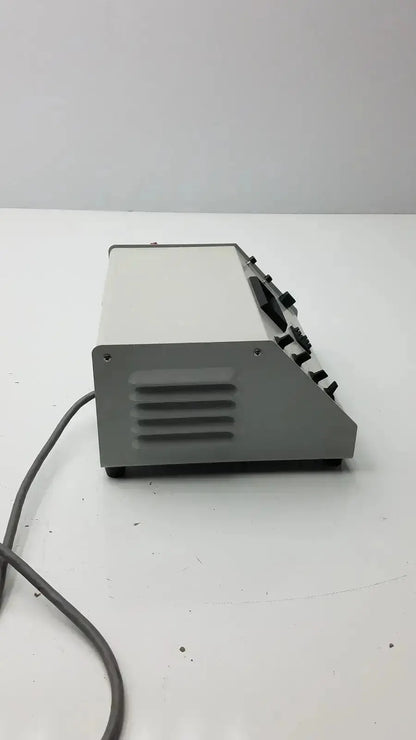 Gray rectangular wheaton unispense ii dose counter with black knobs and vented side panel model g-bbdd4-14u