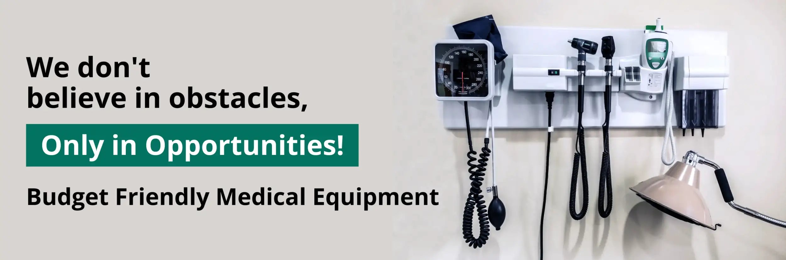 White wall-mounted medical equipment rack holding various diagnostic tools