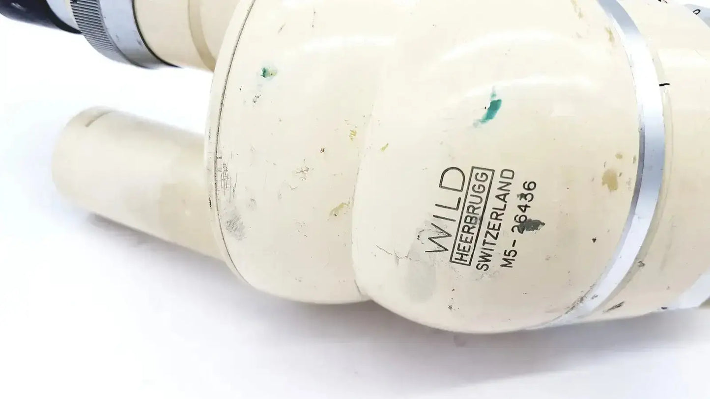 Cream-colored plastic pipe fitting with silver metallic band and engraved branding for wild heerbrugg m5-26436 microscope