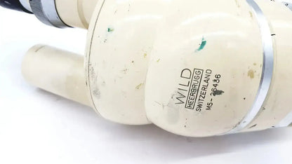 Cream-colored plastic pipe fitting with silver metallic band and engraved branding for wild heerbrugg m5-26436 microscope