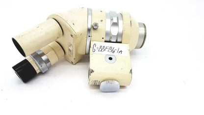 Cream-colored wild heerbrugg m5-26436 microscope with metallic silver accents and a handwritten label on the body