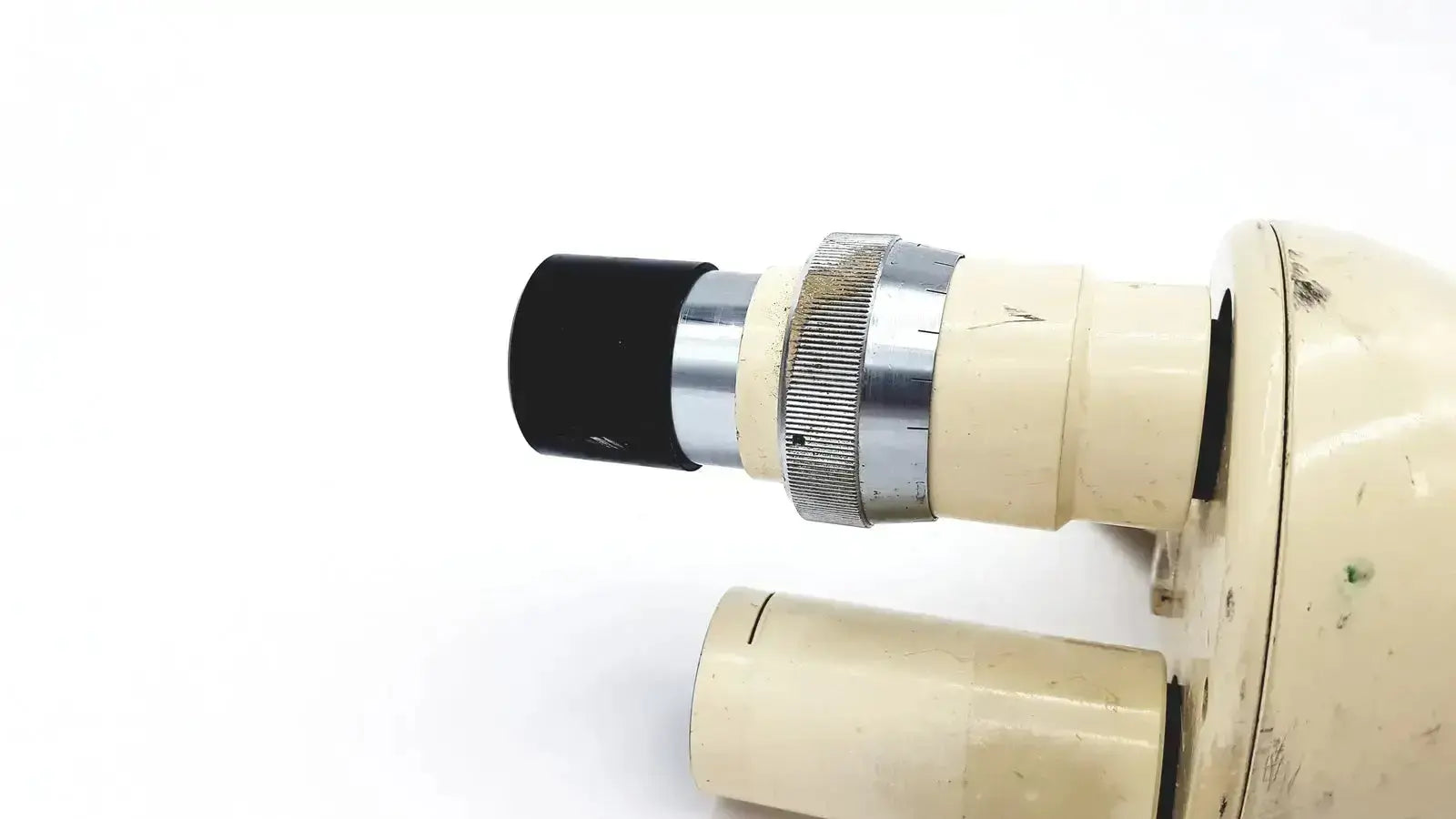 Cream-colored Wild Heerbrugg M5-26436 microscope with black eyepiece and silver metallic focusing ring