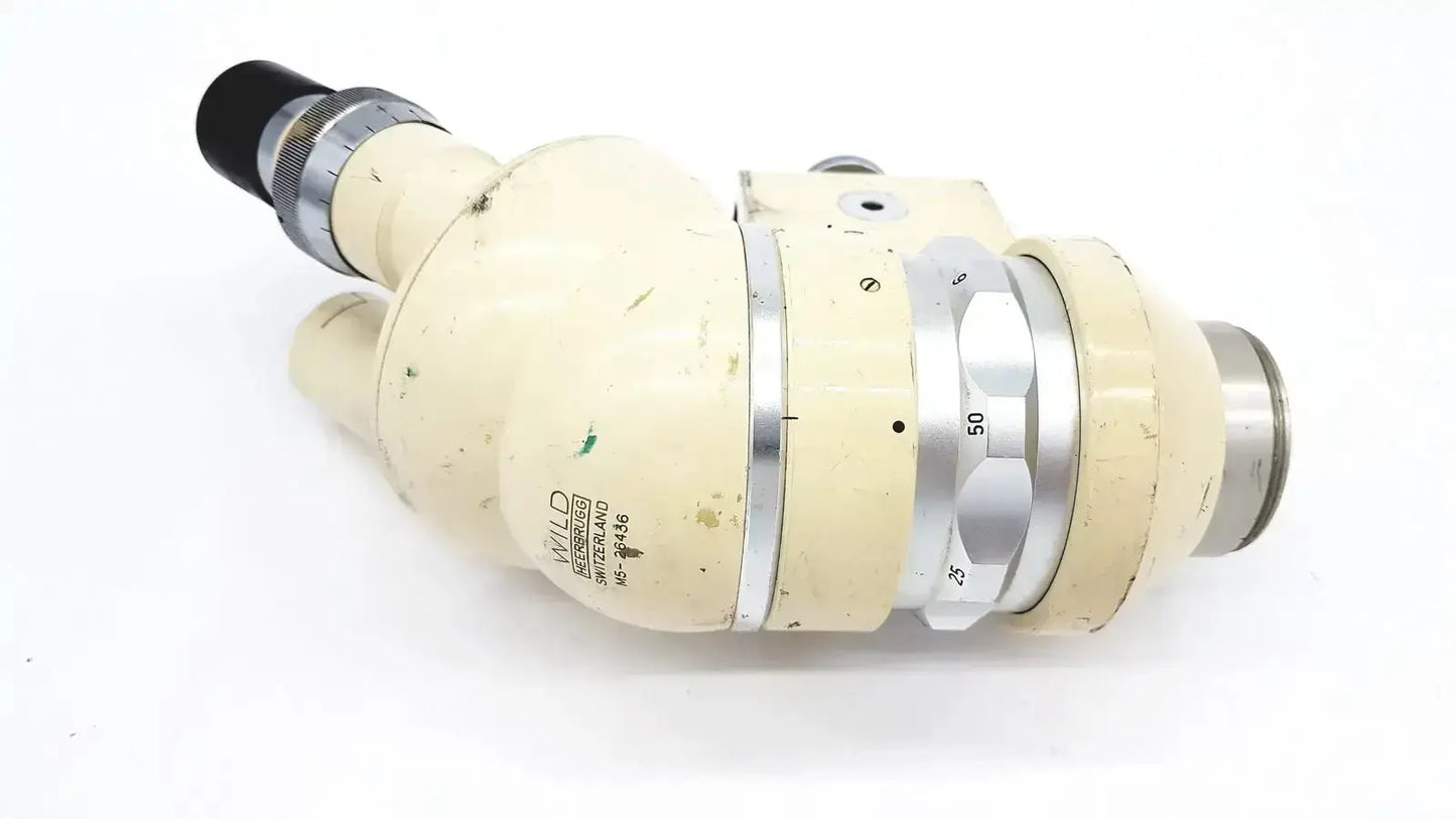 Vintage cream-colored wild heerbrugg m5-26436 microscope with silver metallic rings and black eyepiece for precise viewing