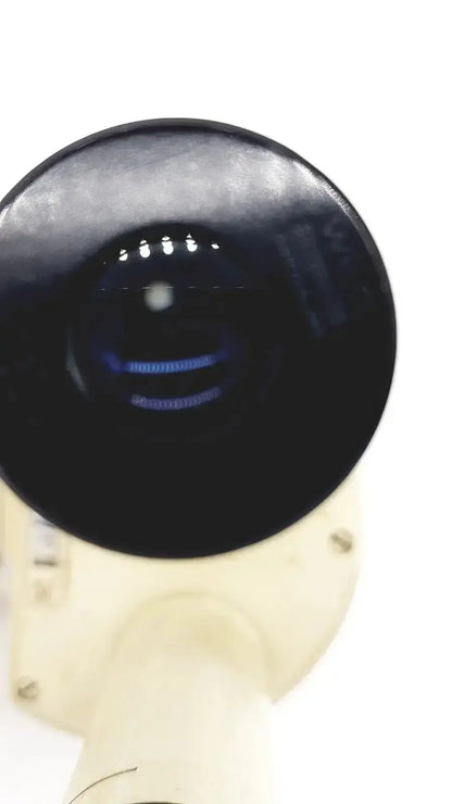 Black circular glossy lens mounted on off-white housing of wild heerbrugg m5-26436 microscope