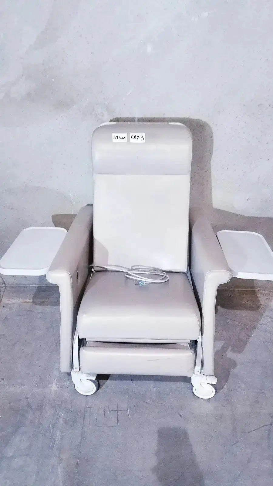 Beige upholstered Winco 694 care recliner dialysis chair with back massager vibrate integrated side tables and caster wheels